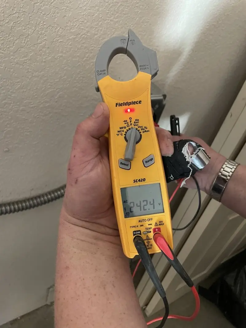 Voltage testing with clamp meter during Outlet Installation in Imperial